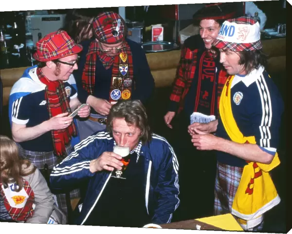 Denis Law has a drink with Scottish fans at the 1978 World Cup