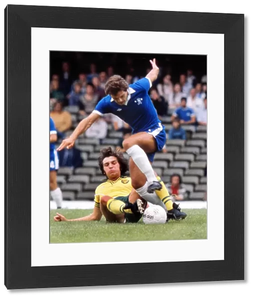 Norwichs Kevin Reeves tackles Ray Wilkins