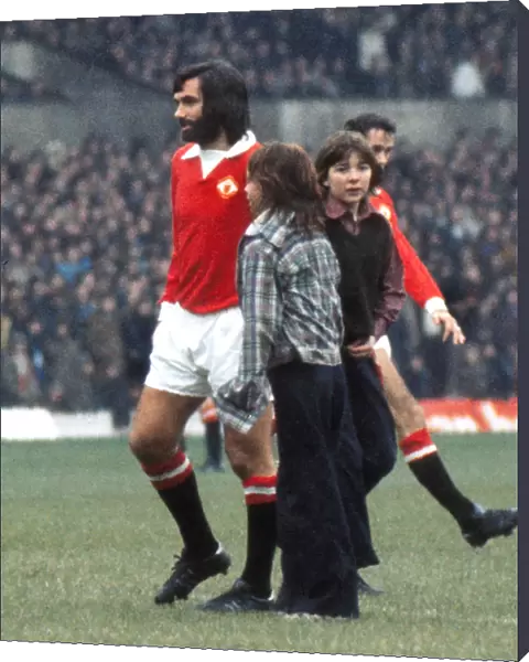 George Best is greeted by young fans before kick-off on his first team return for Manchester United in 1973