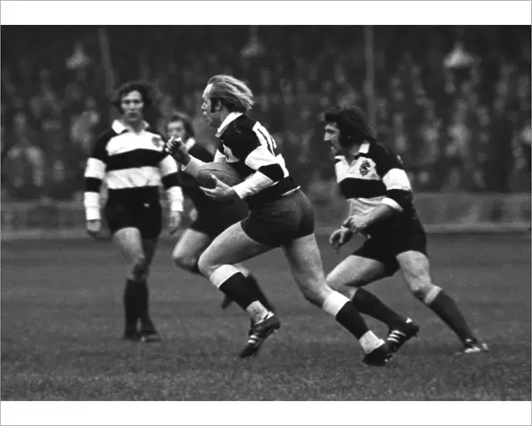 David Duckham runs with the ball for the Barbarians against the All Blacks in 1973