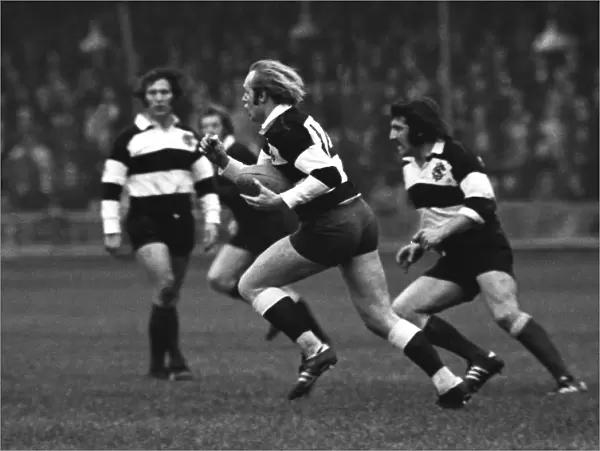 David Duckham runs with the ball for the Barbarians against the All Blacks in 1973