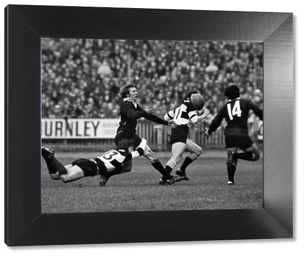 John Dawes puts in a flying tackle on Bruce Robertson during the famous 1973 Barbarians-All Blacks game