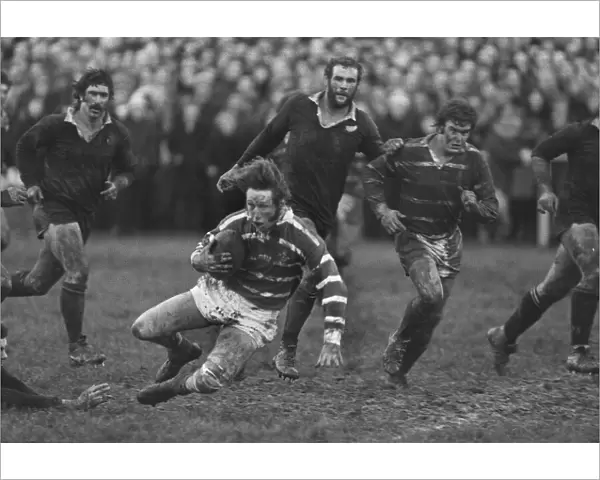A bloodied JPR Williams in action for Bridgend against the All Blacks in 1978