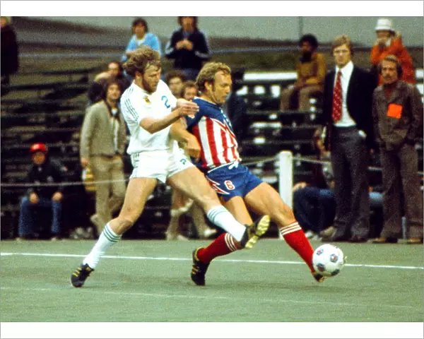 San Antonios Bobby Moore wins the ball from Portlands Ray Martin - 1976 NASL