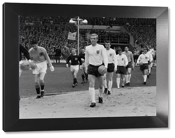 Bobby Moore leads England out against Scotland at Wembley in 1965