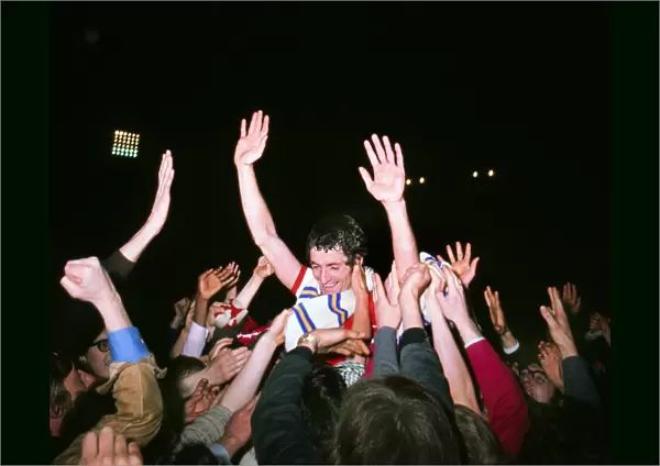 Frank McLintock celebrates with the fans after Arsenal win the 1971 league title