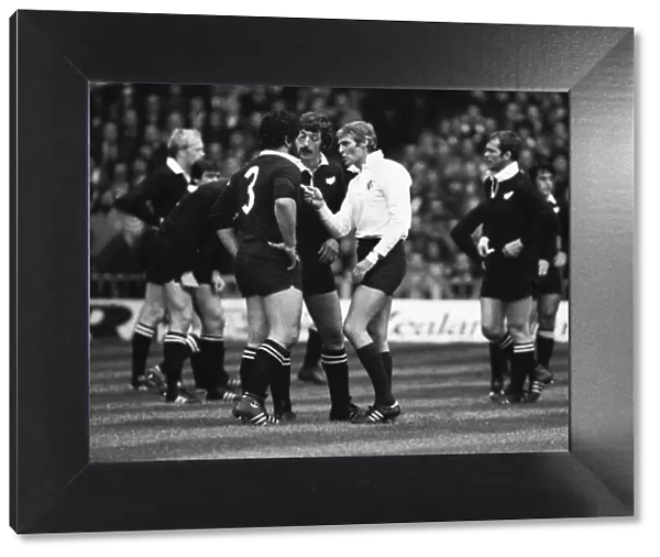 Referee Roger Quittenton lectures New Zealands Billy Bush as captain Graham Mourie looks on