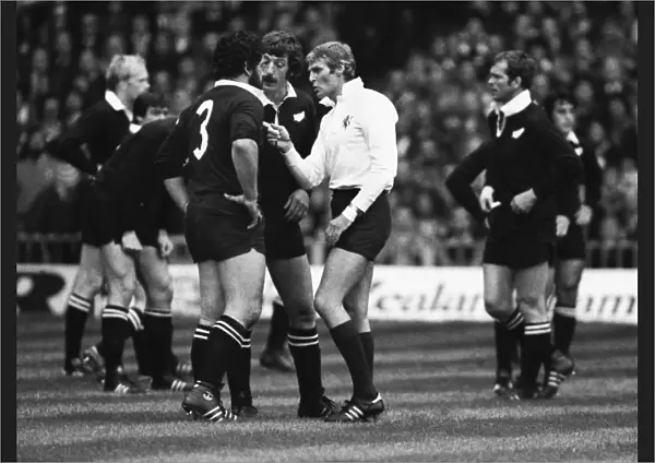 Referee Roger Quittenton lectures New Zealands Billy Bush as captain Graham Mourie looks on