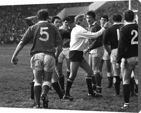 Referee Roger Quittenton steps-in to stop the Scottish and Welsh forwards fighting - 1983 Five Nations