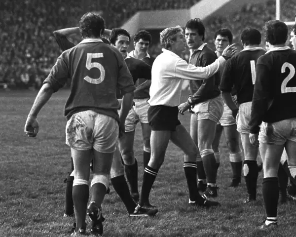 Referee Roger Quittenton steps-in to stop the Scottish and Welsh forwards fighting - 1983 Five Nations