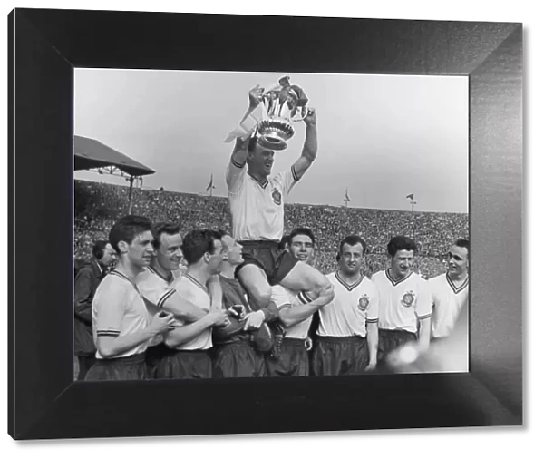 Bolton Wanderers captain Nat Lofthouse is chaired by his teammates after victory in the 1958 FA Cup Final