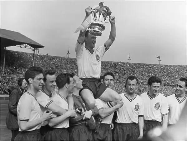 Bolton Wanderers captain Nat Lofthouse is chaired by his teammates after victory in the 1958 FA Cup Final