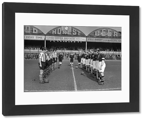 Aston Villa and Stoke City observe a minutes silence at Villa Park for the death of Queen Mary in 1953