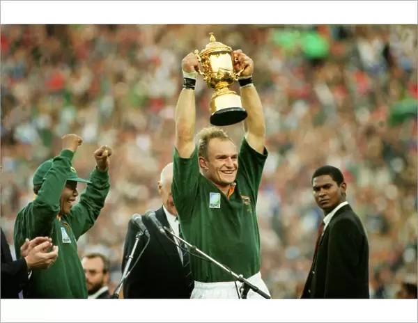 Francois Pienaar lifts the World Cup for South Africa as Nelson Mandela cheers