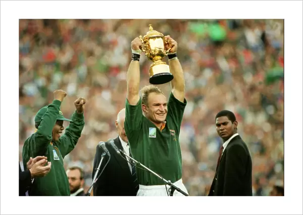 Francois Pienaar lifts the World Cup for South Africa as Nelson Mandela cheers