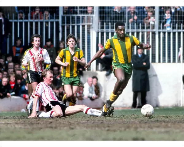 West Broms Laurie Cunningham evades a sliding tackle from Southamptons David Peach