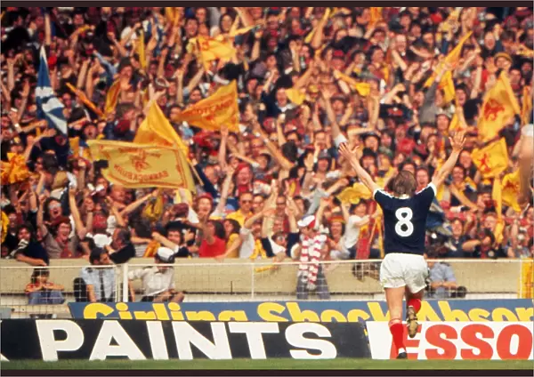 Kenny Dalglish celebrates his goal in front of the Scotland fans at Wembley - 1977 British Home Championship