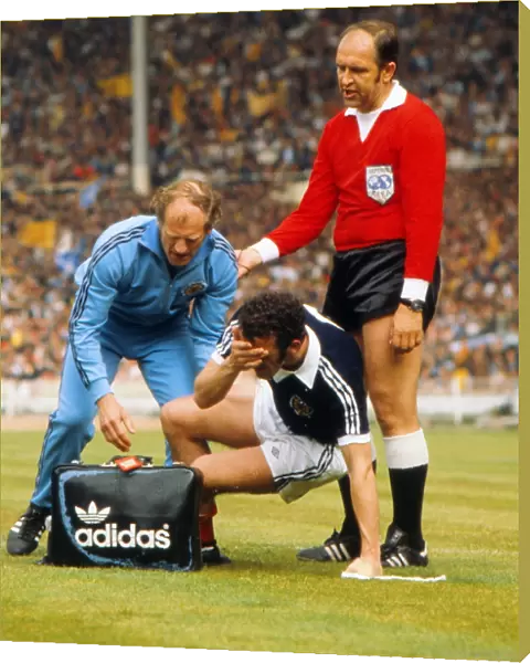 Scotlands Danny McGrain is injured - 1977 British Home Championship
