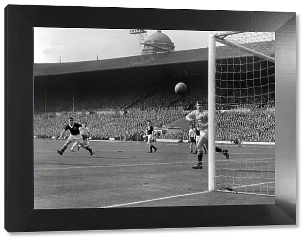 Englands Bobby Smith shoots past Scotland goalkeeper Frank Haffey - 1960  /  1 British Home Championship