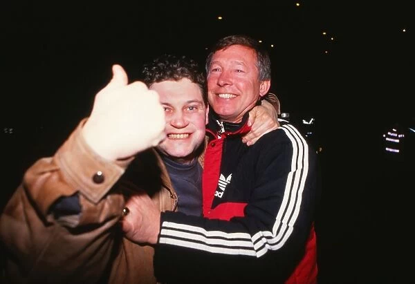 Alex Ferguson celebrates with a fan after Manchester City reach the 1990 FA Cup Final