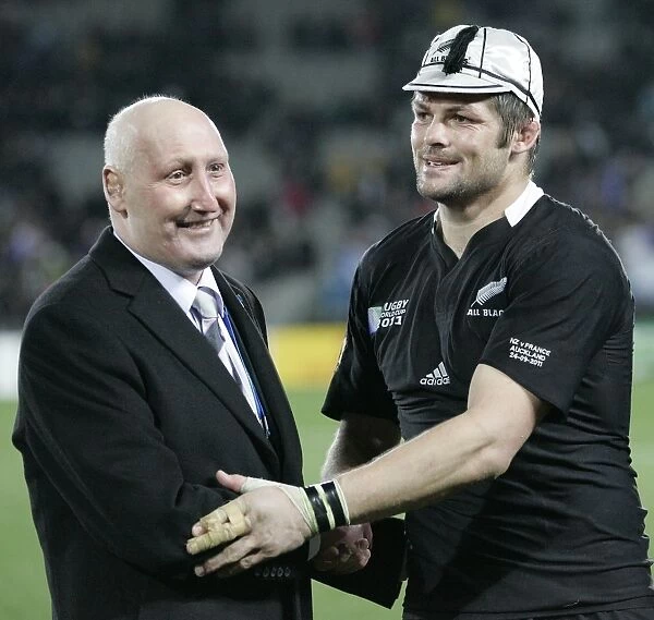 Former All Black Jock Hobbs presents Richie McCaw with his 100th cap