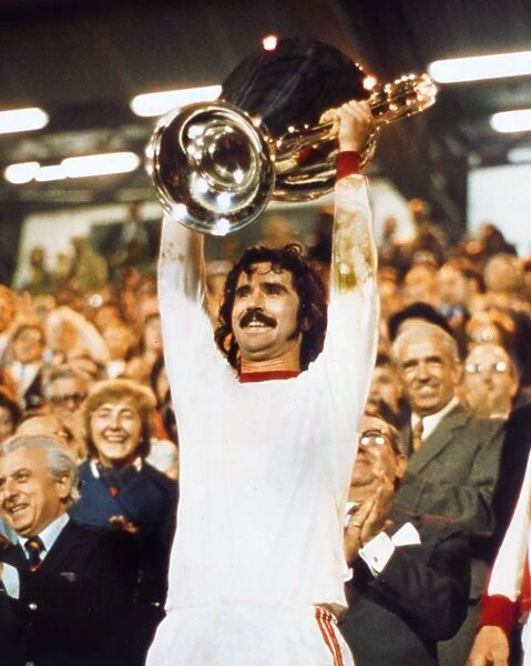 Bayern Munichs Gerd Muller lifts the European Cup in 1974