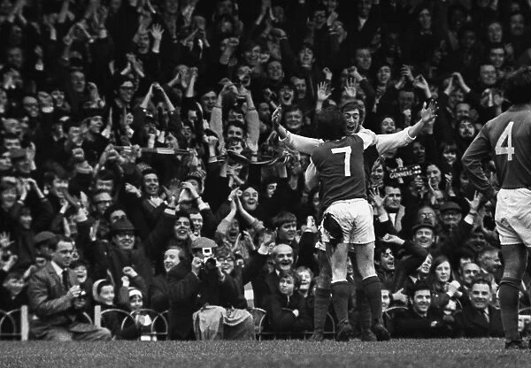 Charlie George celebrates a goal for Arsenal