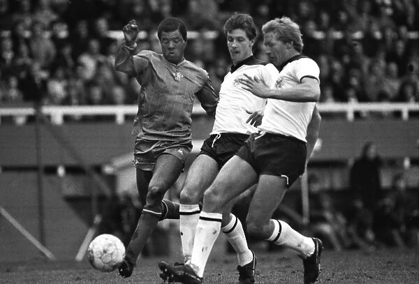 Chelseas Paul Canoville, left, and Fulhams Roger Brown and Tony Gale in 1983