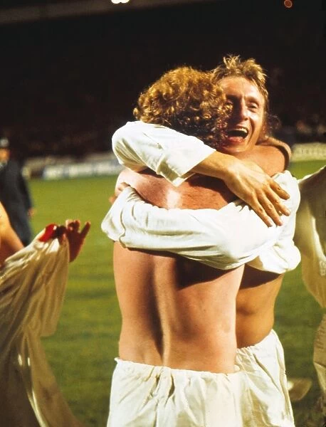 Denis Law celebrates with Billy Bremner after Scotland qualify for the 1974 World Cup