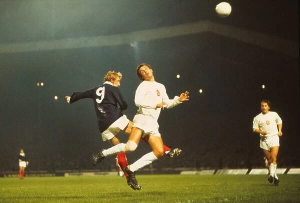 Denis Law jumps for a header during the game that gave Scotland qualification for the 1974 World Cup