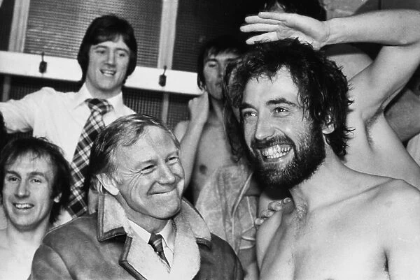 Dickie Guy and his Wimbledon teammates celebrate in the Elland Road changing rooms during the 1975 FA Cup