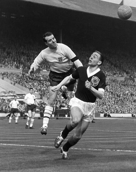 England goalkeeper Ron Springett punches clear from Ian St. John - 1960 / 1 British Home Championship