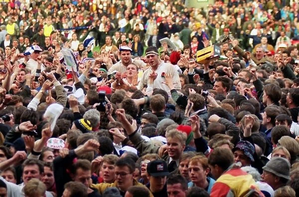 England players are carried off the Twickenham pitch after winning the Grand Slam in 1992