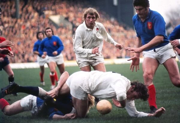 Englands Andy Ripley goes to ground with John Watkins in support - 1975 Five Nations