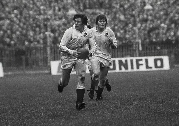 Englands John Pullin is supported by Fran Cotton - 1975 Five Nations