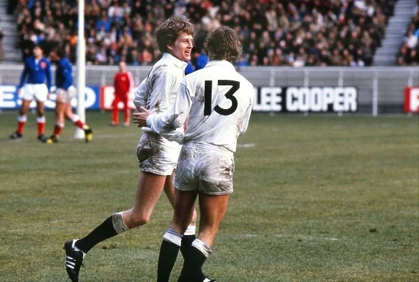 Englands Nick Preston celebrates his try against France with Clive Woodward - 1980 Five Nations