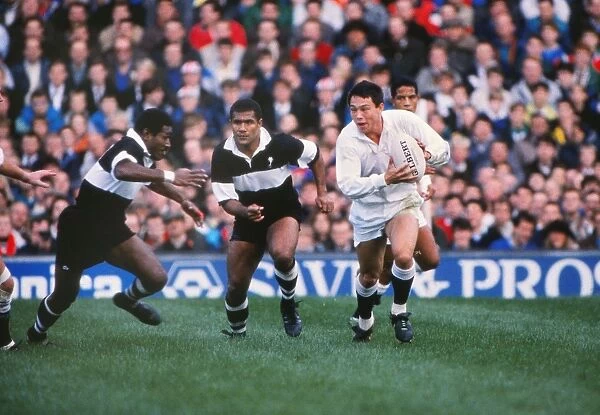Englands Rory Underwood takes on Fiji in 1989
