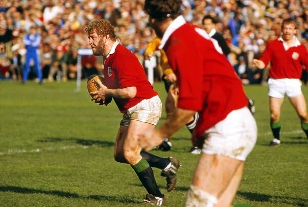 Graham Price runs with the ball for the Lions in 1983