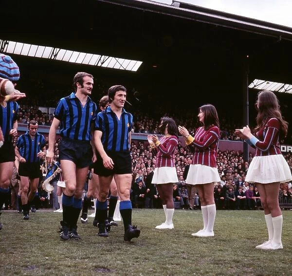 Inters Milans Sandro Mazzola and Gianfranco Bedin are welcomed onto the Selhurst Park pitch by Palace cheerleaders in 1971