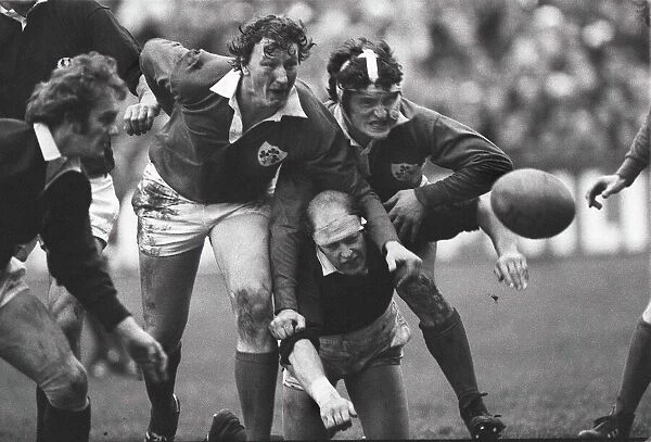 Irelands Willie Duggan and John O Driscoll sandwich Scotlands Mike Biggar - 1978 Five Nations