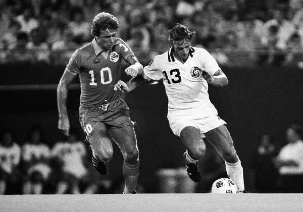 Johan Neeskens is challenged by Alan West during the 1979 NASL