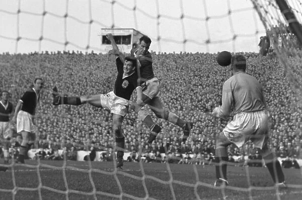 John Charles rises to win a header during the 1957 Home Championship