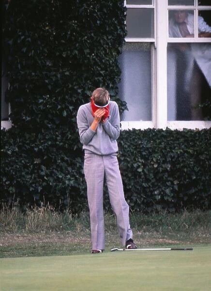 Ken Brown puts his head in his hands after losing his match at the last hole in the 1977 Ryder Cup