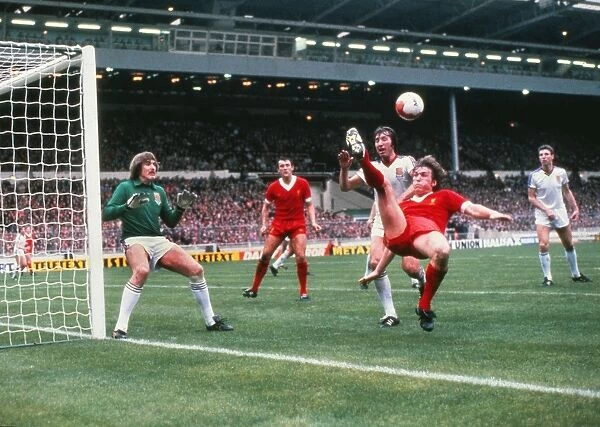 Kenny Dalglish attempts to keep the ball in play