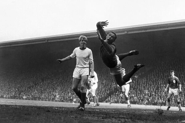LArsenal goalkeeper James Jim Furnell dives for the ball as teammate Ian Ure looks on in 1964