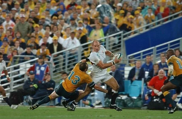 Lawrence Dallaglio runs with the ball during the build-up to Englands try in the 2003 World Cup Final