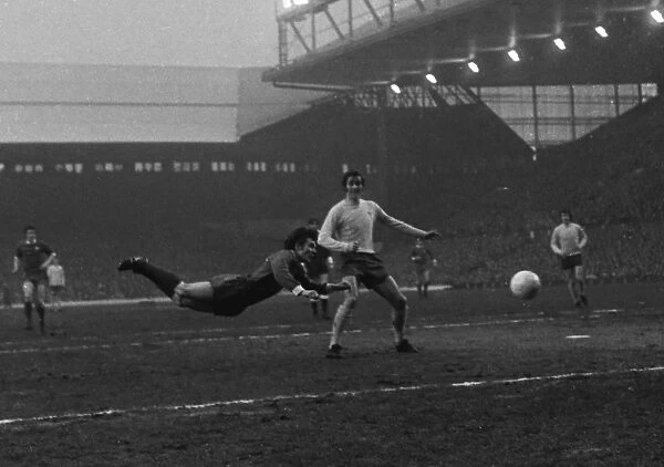 Liverpools Brian Hall puts in a diving header against Arsenal