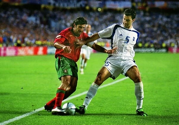 Luis Figo and Traianos Dellas during the Euro 2004 Final