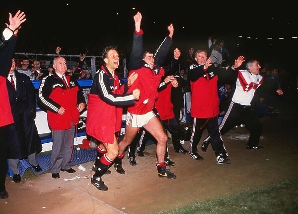 The Manchester United bench celebrate after reaching the 1990 FA Cup Final