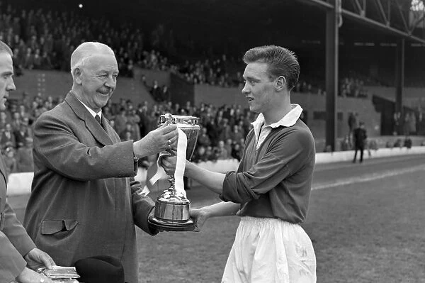 Manchester United captain Eddie Colman receives the FA Youth Cup in 1955